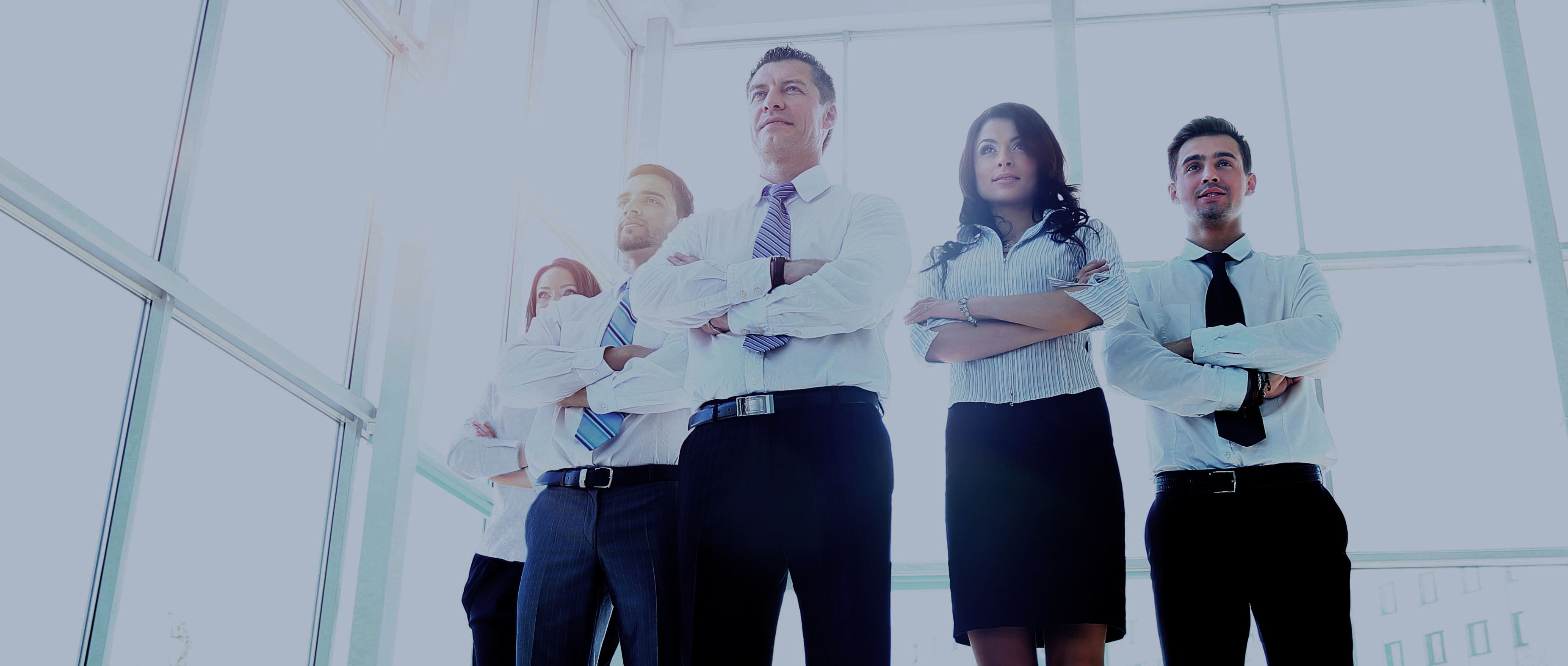 Portrait of businessman leading his team at office