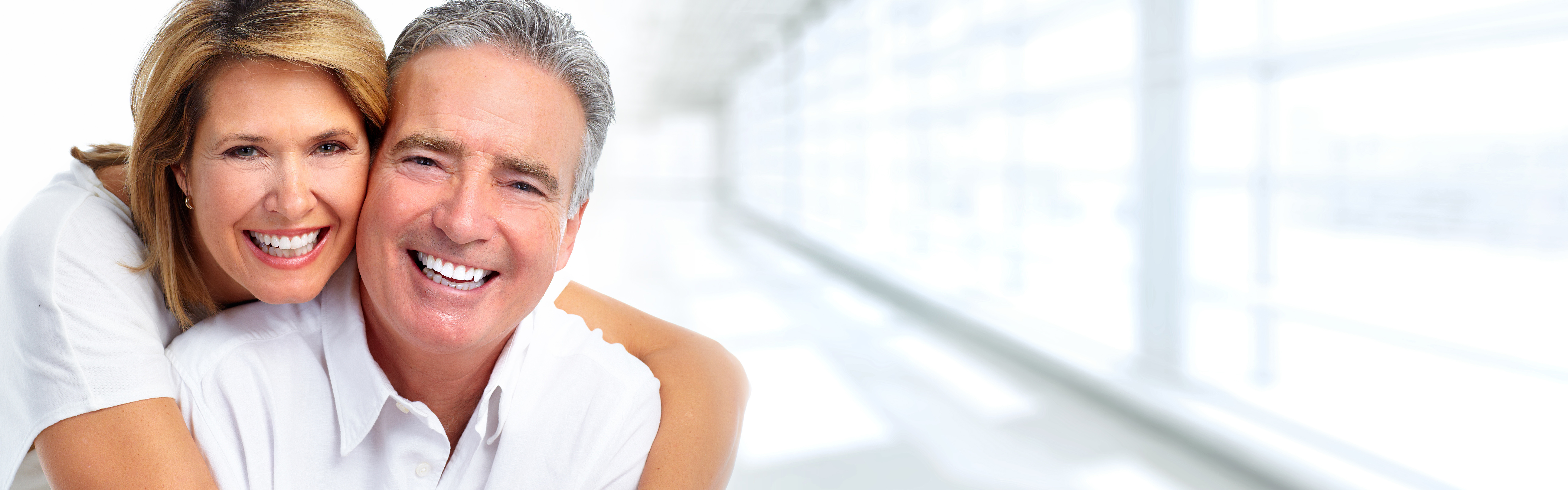 Happy smiling elderly couple over blue background