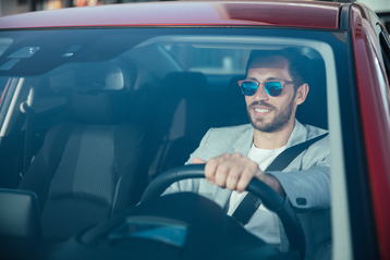 Handsome man driving his car